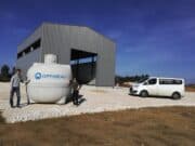 L’eau de pluie revisitée Philippe et Corinne devant le futur atelier en construction